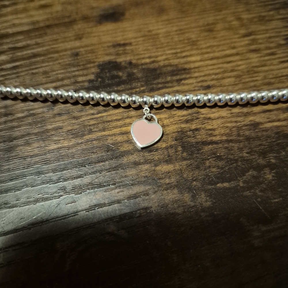 Tiffany & Co. Silver Bracelet with Pink Heart Charm